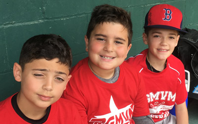 players in dugout smile for picture