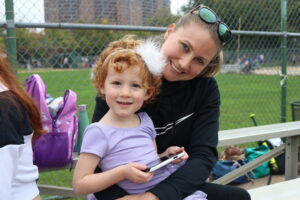 mother and daughter in the bleachers