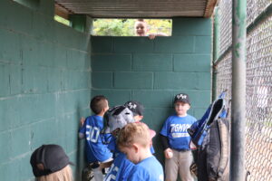 players in dugout gettting ready