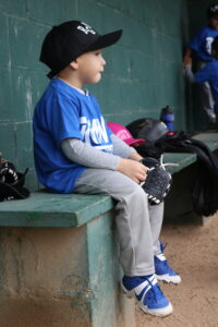 player sitting in dugout
