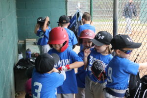 plaers in dugout getting ready