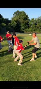 players and coach celebrate on the field