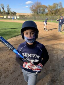 player with bat walking