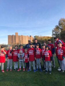 team picture with child holding trophy